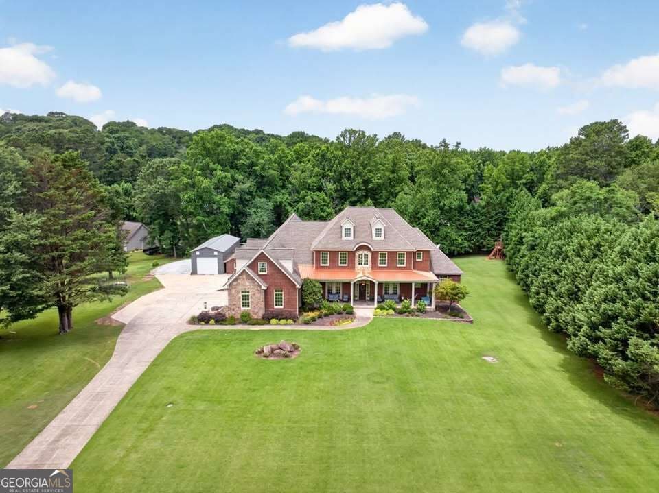 7 bedroom, 6.5 bathroom, 9,752 sq ft single family residence under contract at 4728 E Reed Road, Gainesville, GA 30507 — photo 4