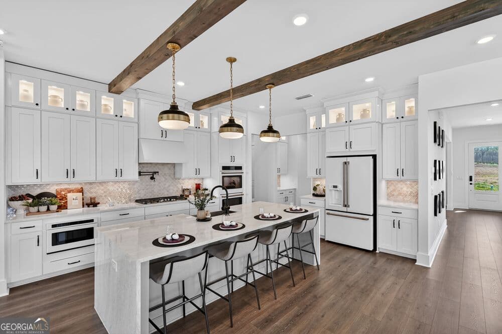 5 bedroom, 4 bathroom, 3,430 sq ft single family residence for sale at 4830 Denning Lane, Cumming, GA 30040 — photo 2