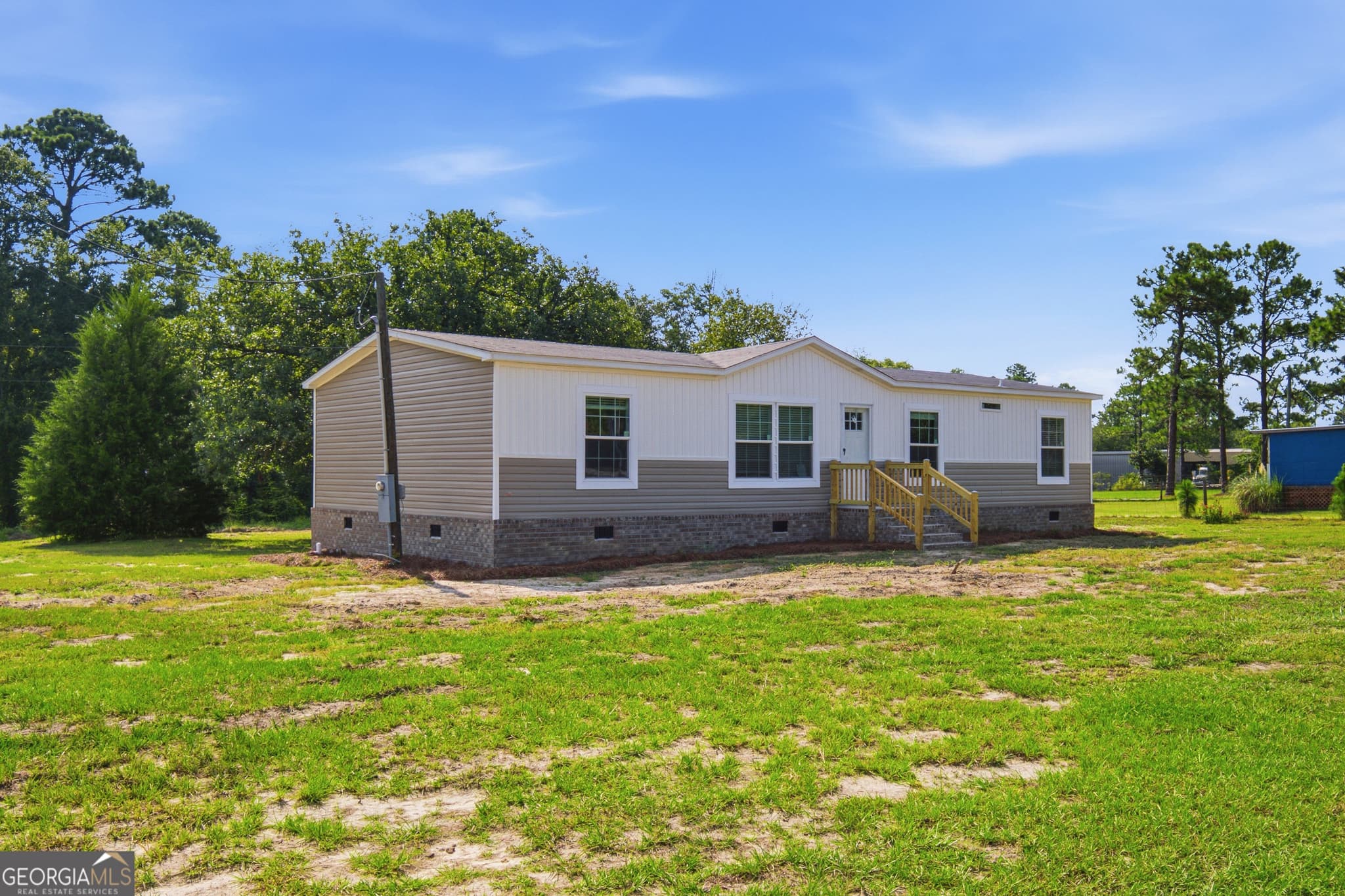 4 bedroom, 2.5 bathroom, 1,568 sq ft manufactured home,single family residence for sale at 1137 5th Avenue, Twin City, GA 30471 — photo 2