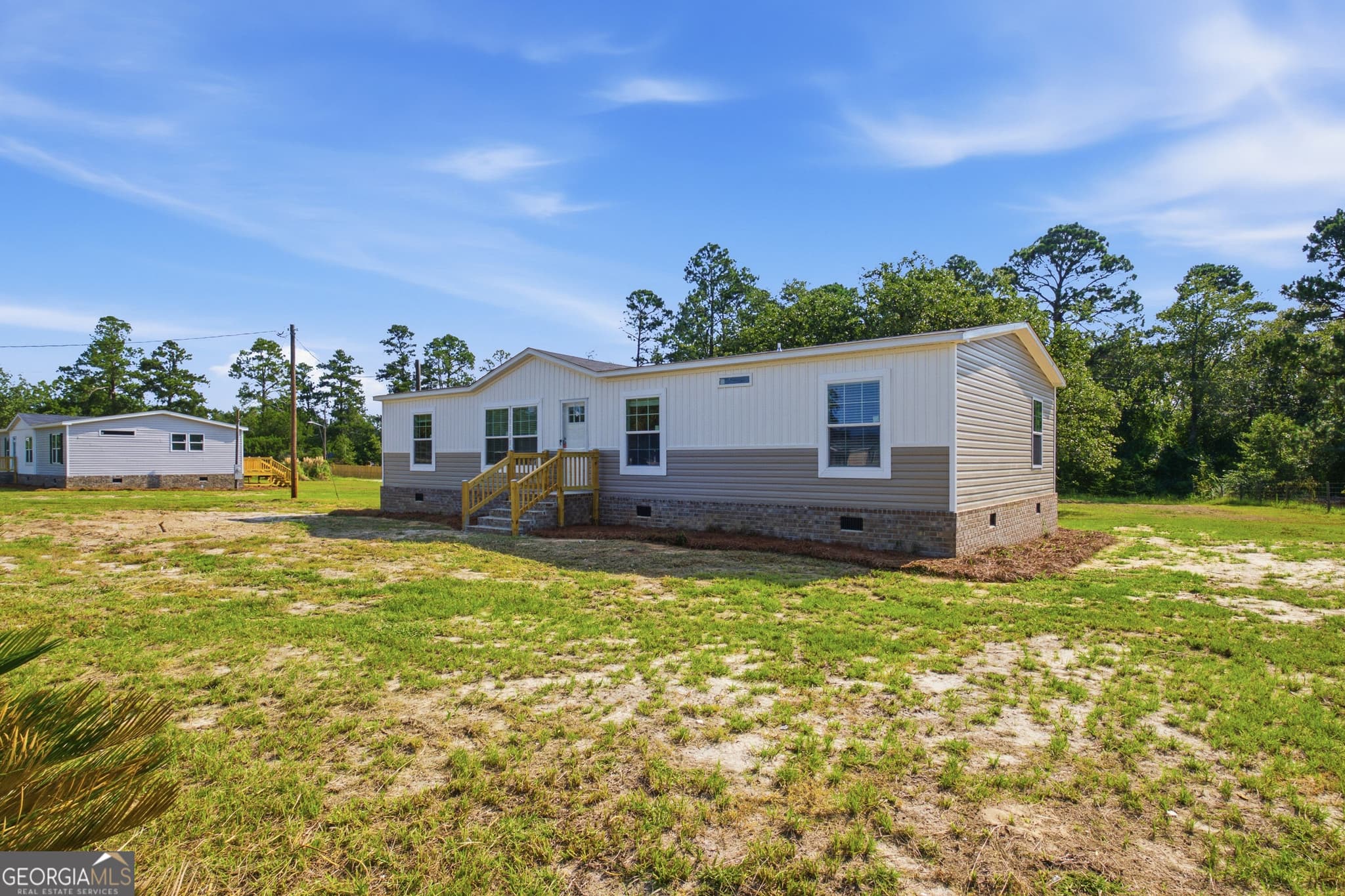 4 bedroom, 2.5 bathroom, 1,568 sq ft manufactured home,single family residence for sale at 1137 5th Avenue, Twin City, GA 30471 — photo 3