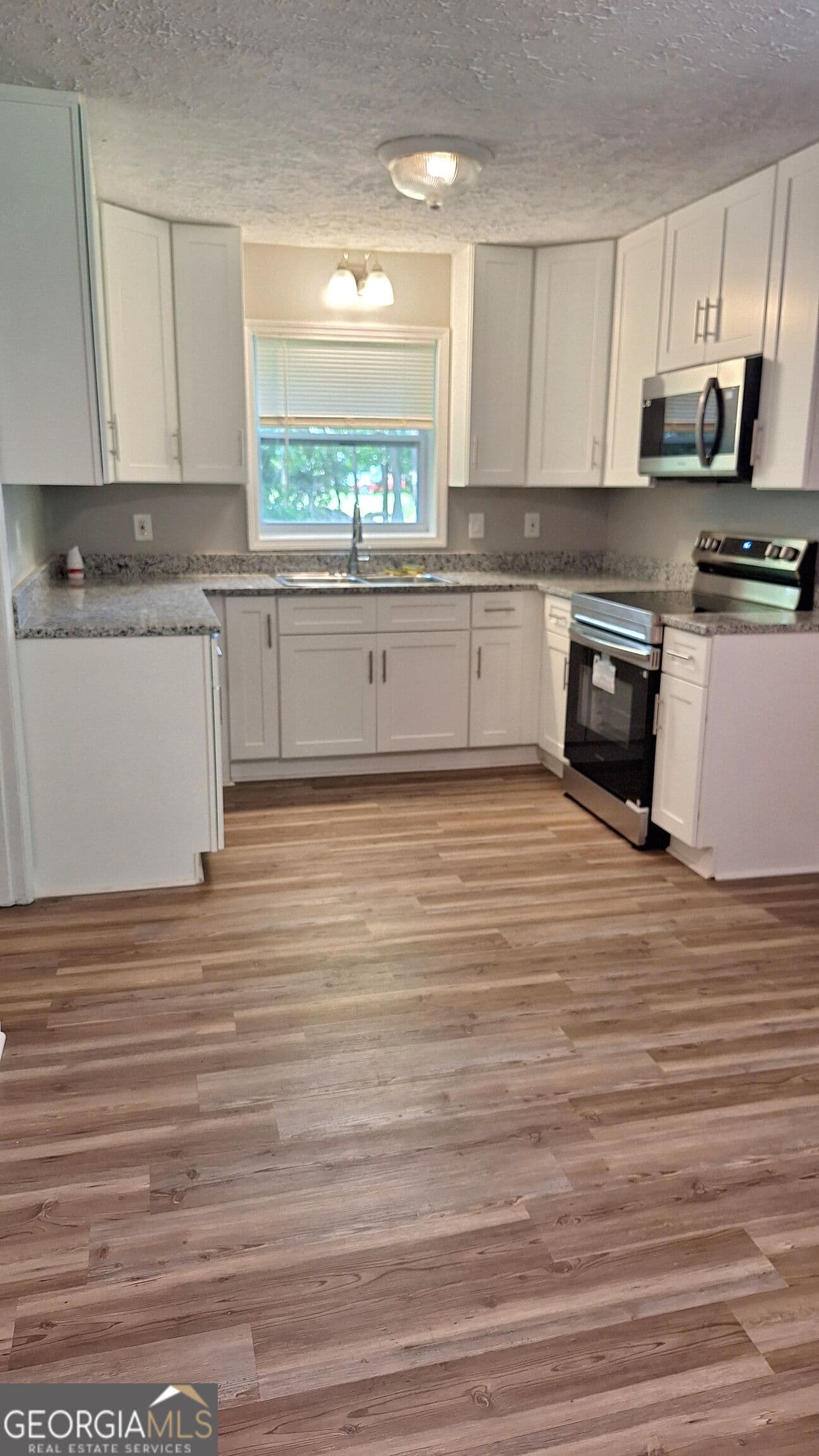 4 bedroom, 2 bathroom, 1,225 sq ft single family residence for sale at 1189 Grace Street, Mableton, GA 30126 — photo 3