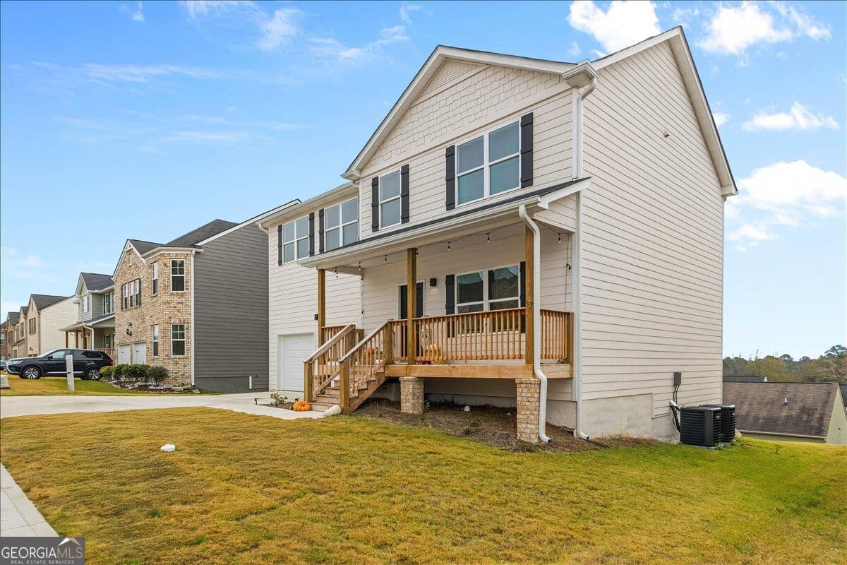 4 bedroom, 2.5 bathroom single family residence for sale at 3414 Enterkin Lane, Atlanta, GA 30349 — photo 2