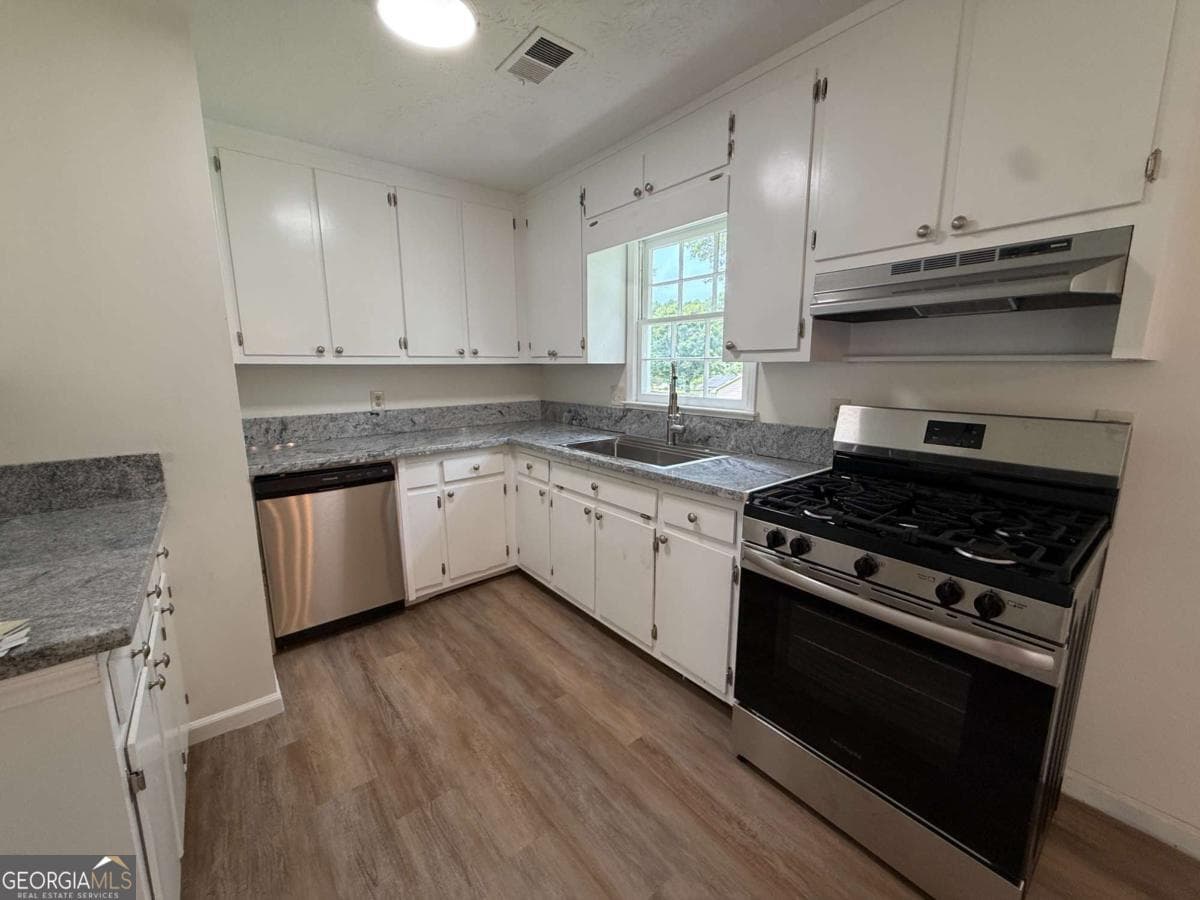 4 bedroom, 1.5 bathroom, 1,456 sq ft single family residence for sale at 3165 Delhi Drive, Powder Springs, GA 30127 — photo 7