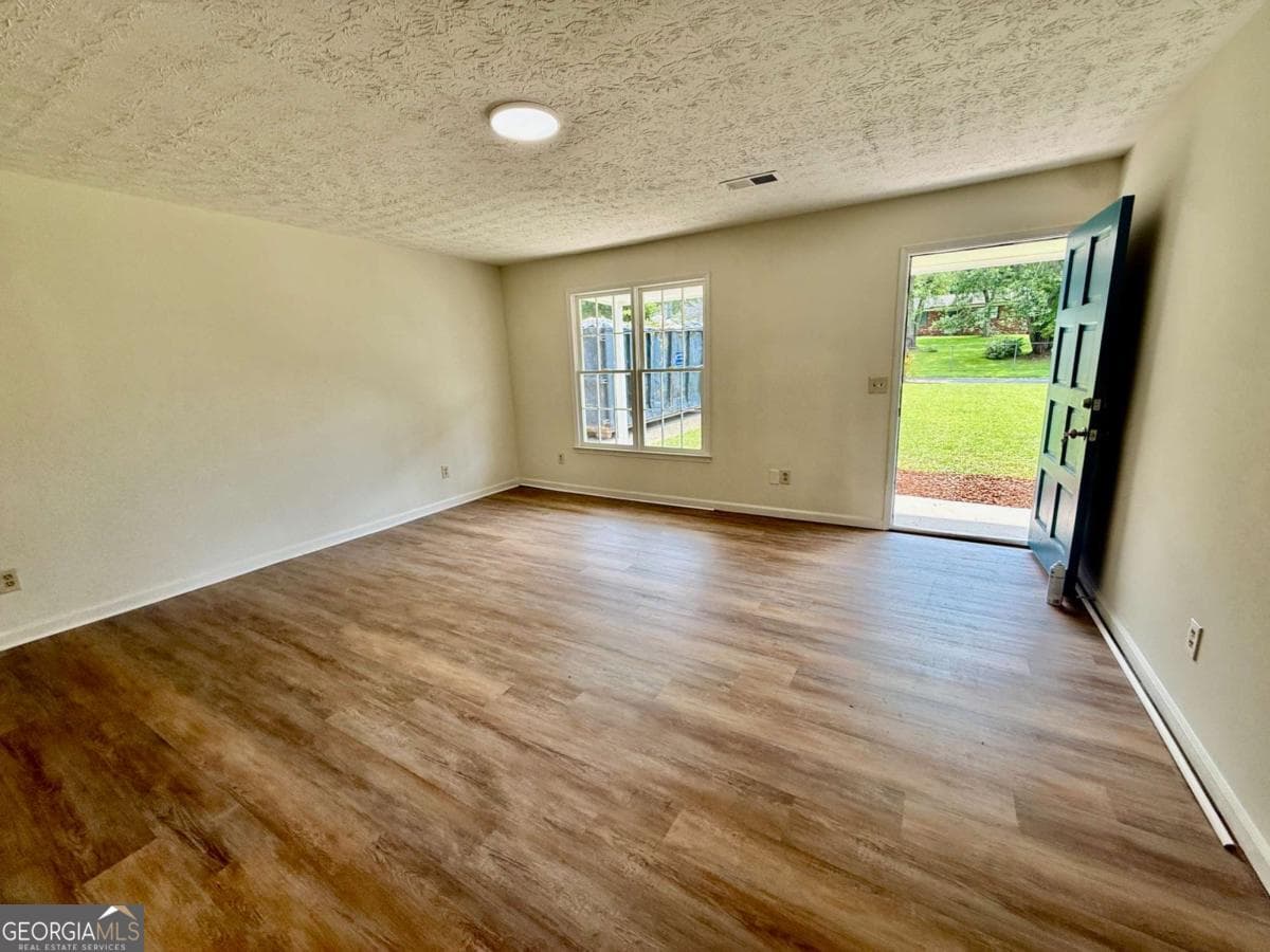 4 bedroom, 1.5 bathroom, 1,456 sq ft single family residence for sale at 3165 Delhi Drive, Powder Springs, GA 30127 — photo 3
