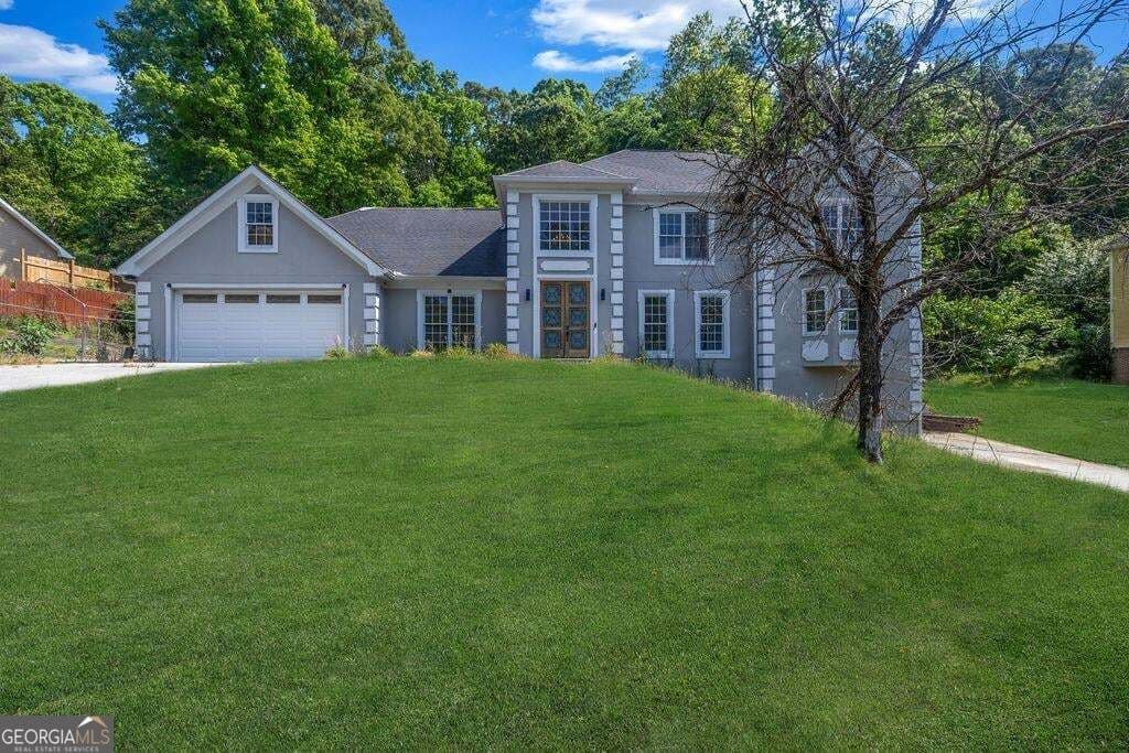 5 bedroom, 4 bathroom, 3,785 sq ft single family residence for sale at 4634 Riveredge Cove, Snellville, GA 30039 — photo 2