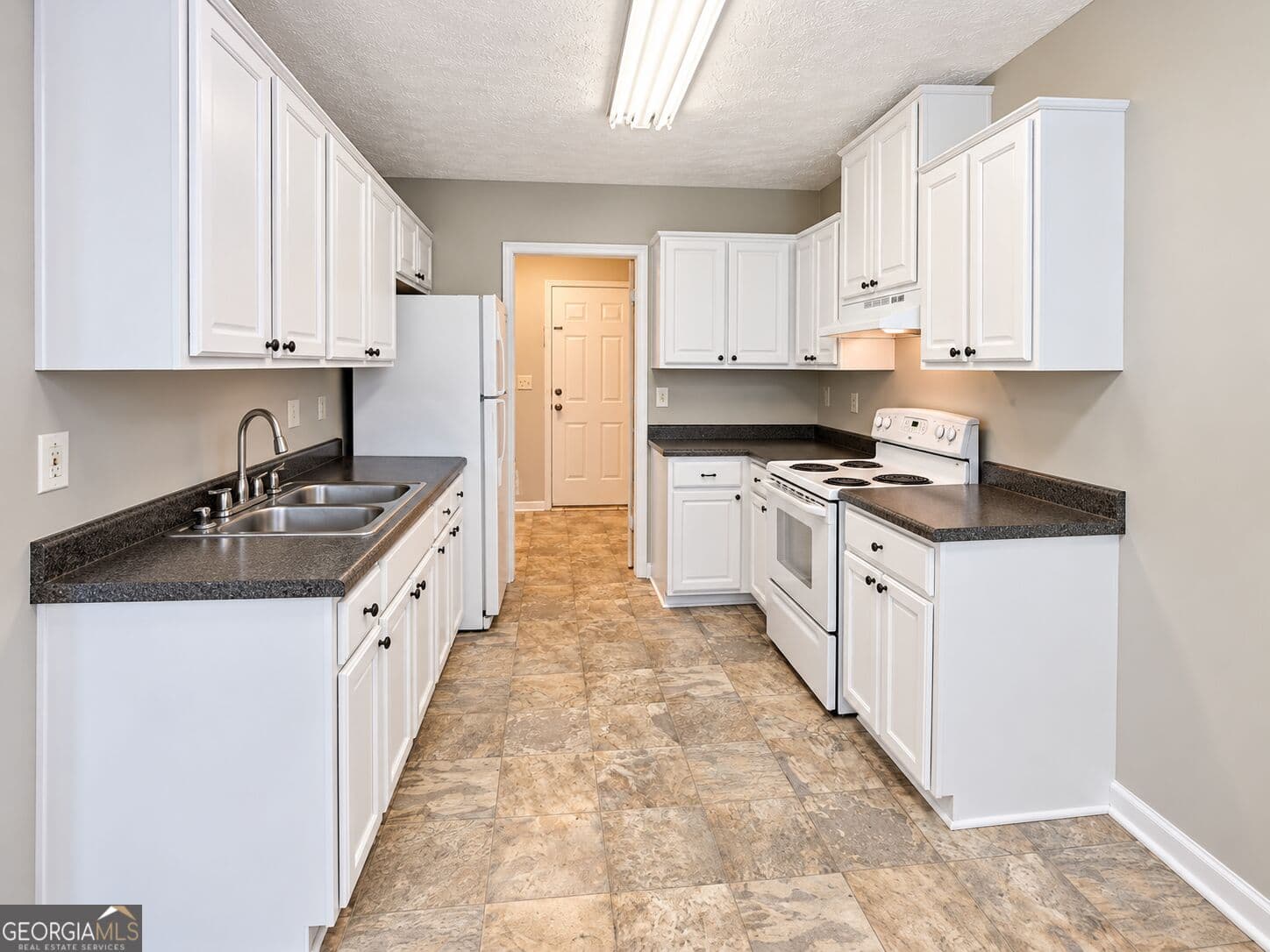 4 bedroom, 4 bathroom, 2,202 sq ft single family residence for sale at 310 Freeport Drive, Lawrenceville, GA 30046 — photo 3