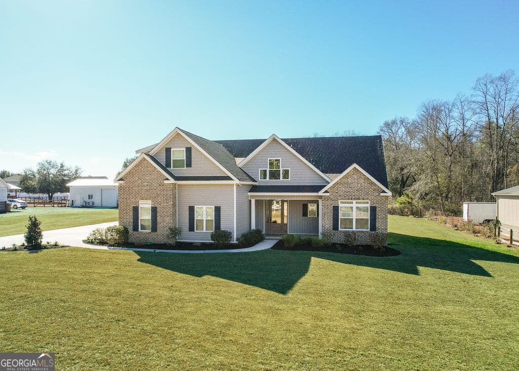4 bedroom, 3.5 bathroom, 3,022 sq ft single family residence for sale at 1355 Old Louisville Road, Guyton, GA 31312 — photo 2