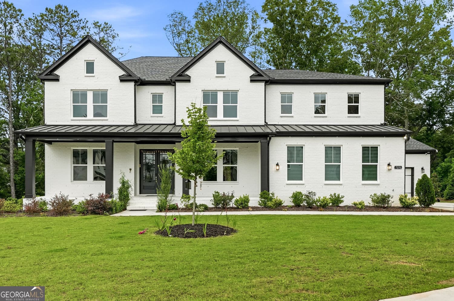6 bedroom, 5.5 bathroom, 5,201 sq ft single family residence sold at 7370 Wispy Hollow, Cumming, GA 30040