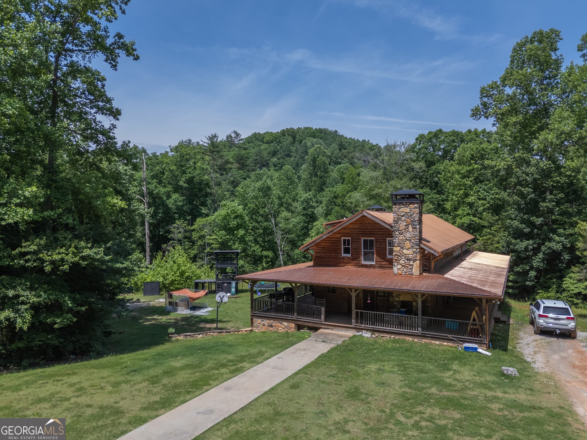 5 bedroom, 3 bathroom, 6,472 sq ft single family residence for sale at 440 Joe Franklin Road, Sautee Nacoochee, GA 30571 — photo 1 of 51
