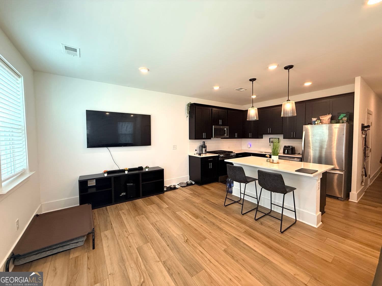 3 bedroom, 2.5 bathroom, 1,362 sq ft townhouse for sale at 1623 Gunnin Trace, Atlanta, GA 30318 — photo 2