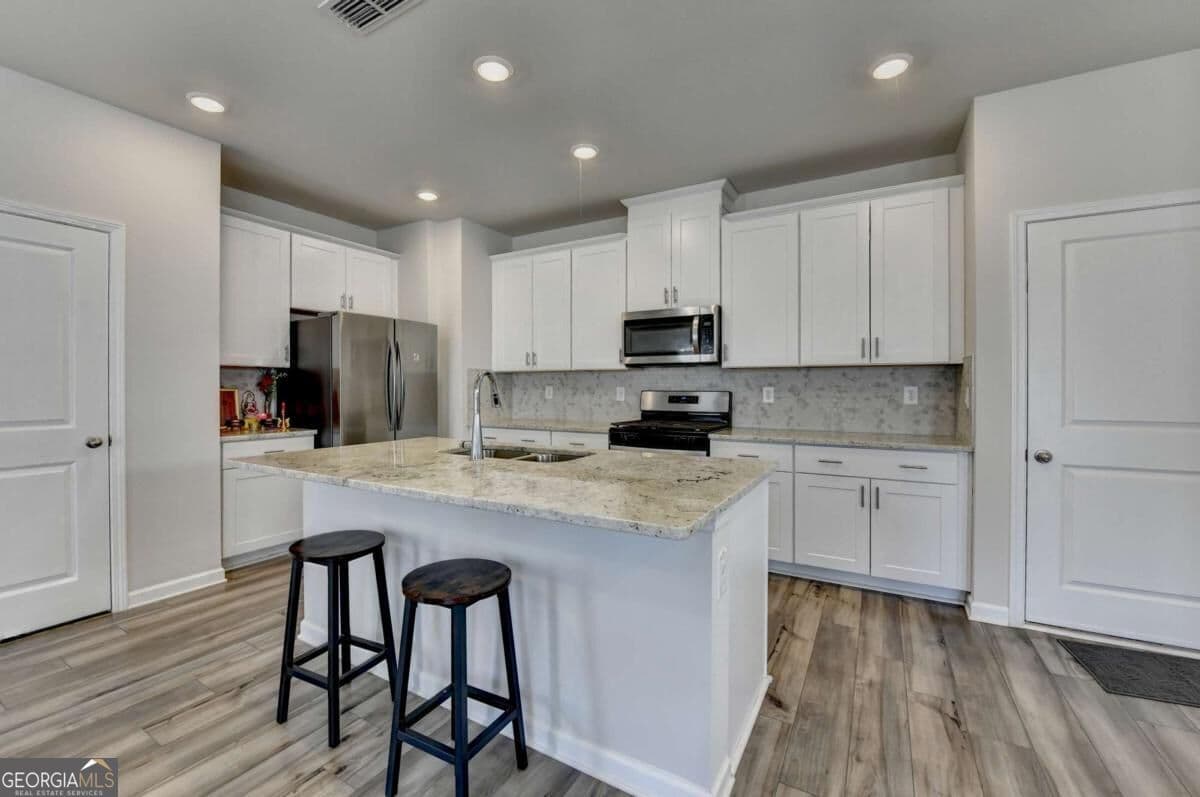 4 bedroom, 2.5 bathroom, 1,963 sq ft single family residence for sale at 2531 Canning View Avenue, Lawrenceville, GA 30044 — photo 9