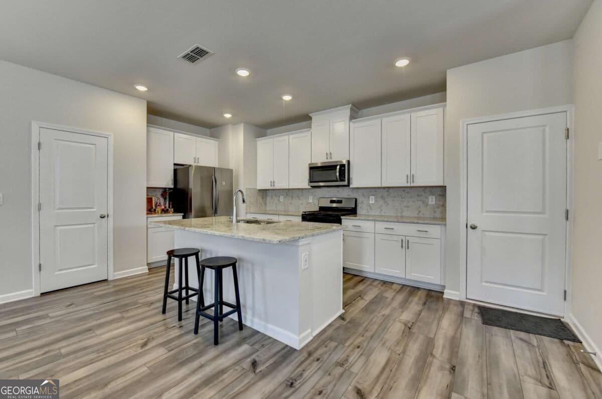4 bedroom, 2.5 bathroom, 1,963 sq ft single family residence for sale at 2531 Canning View Avenue, Lawrenceville, GA 30044 — photo 8