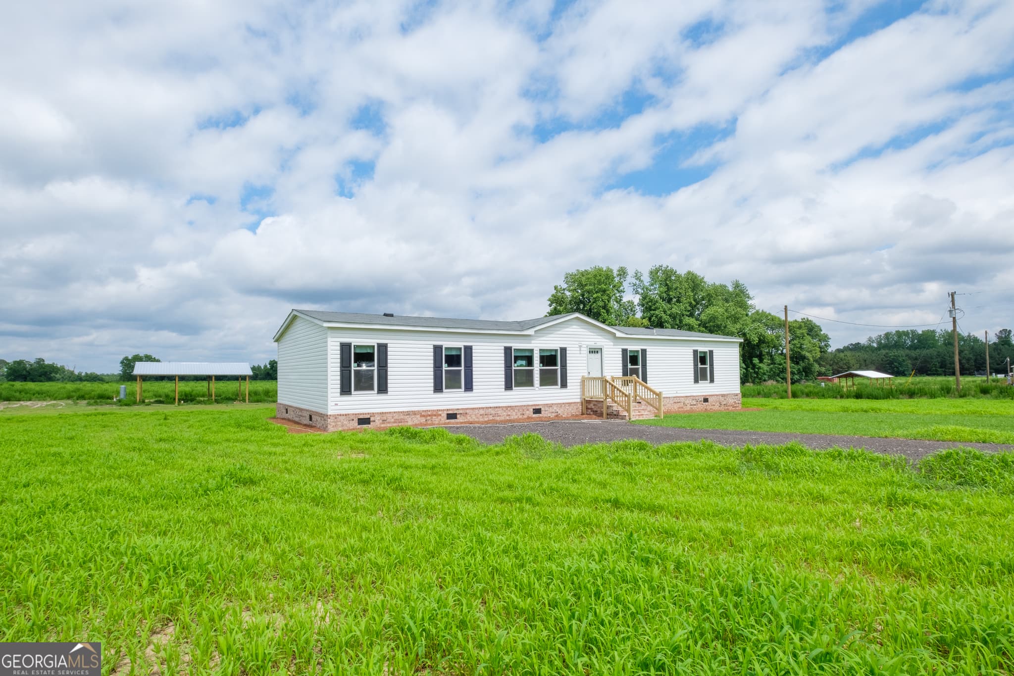 4 bedroom, 2 bathroom, 1,768 sq ft manufactured home,single family residence under contract at 444 LB Hall Road, Garfield, GA 30425 — photo 2