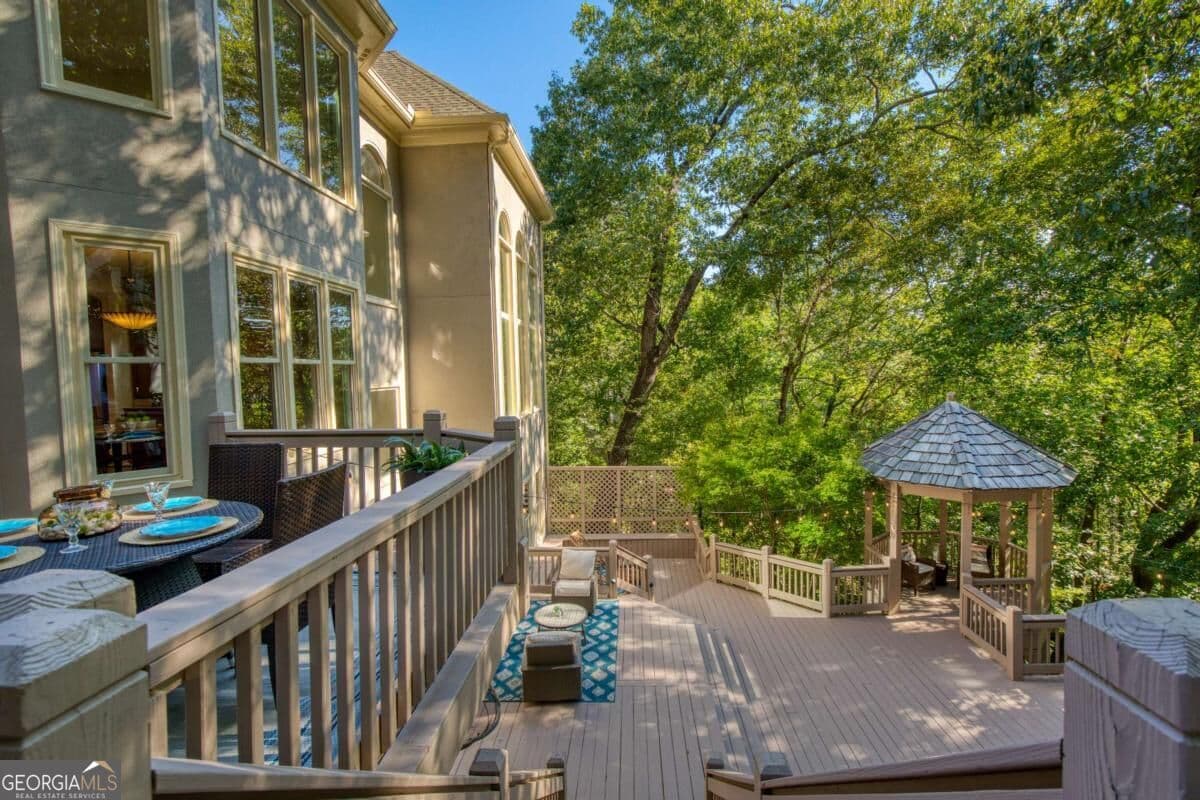 5 bedroom, 5.5 bathroom, 8,055 sq ft single family residence for sale at 8370 Sentinae Chase Drive, Roswell, GA 30076 — photo 4