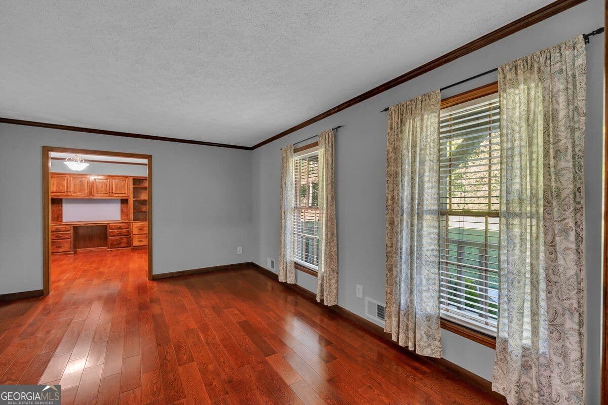 5 bedroom, 4.5 bathroom, 2,821 sq ft single family residence for sale at 6620 New Hope Road, Milner, GA 30257 — photo 3