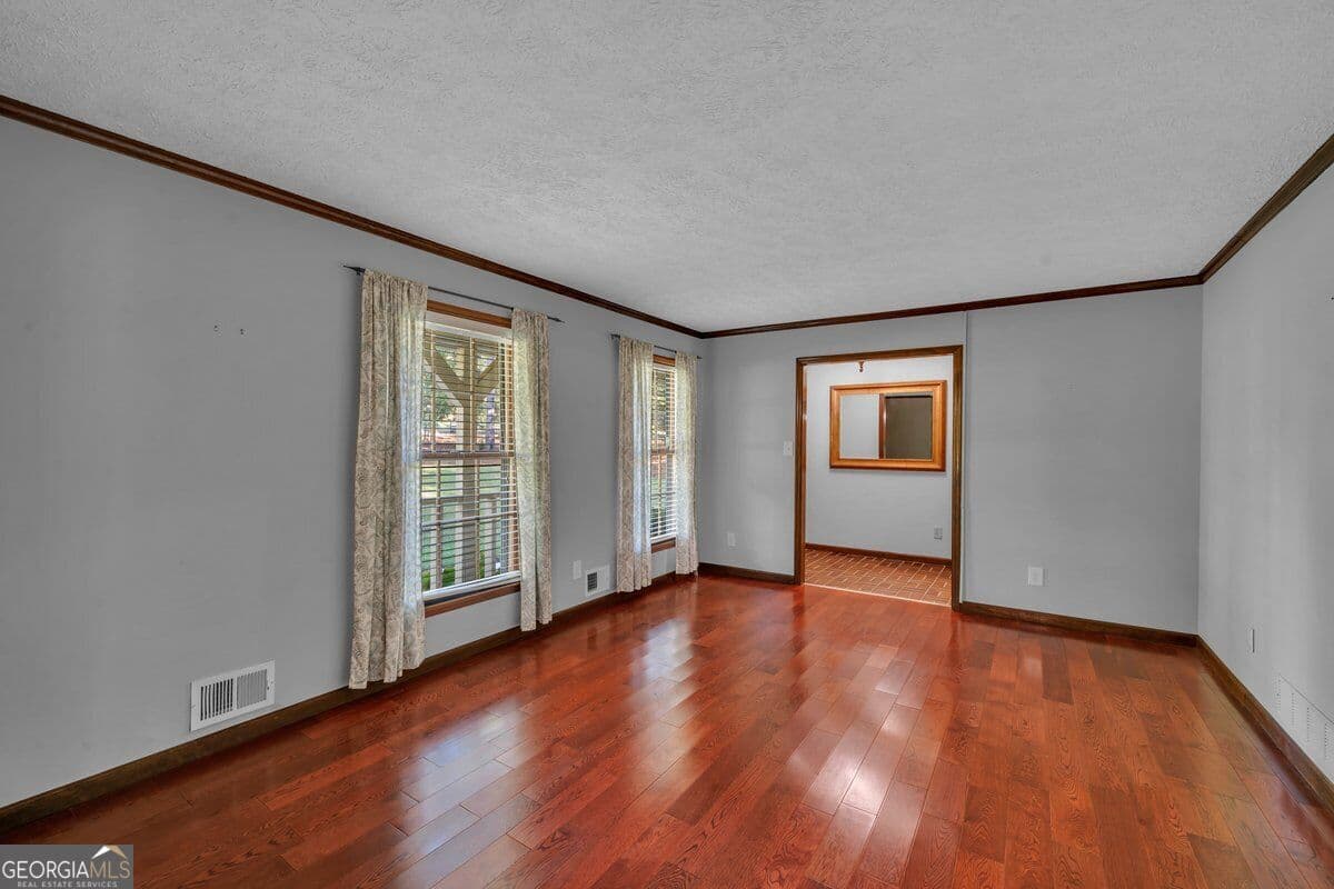 5 bedroom, 4.5 bathroom, 2,821 sq ft single family residence for sale at 6620 New Hope Road, Milner, GA 30257 — photo 4