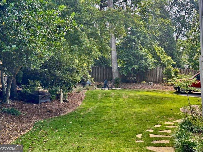 4 bedroom, 2.5 bathroom, 4,229 sq ft single family residence for sale at 3013 Braxton Court, Kennesaw, GA 30152 — photo 5