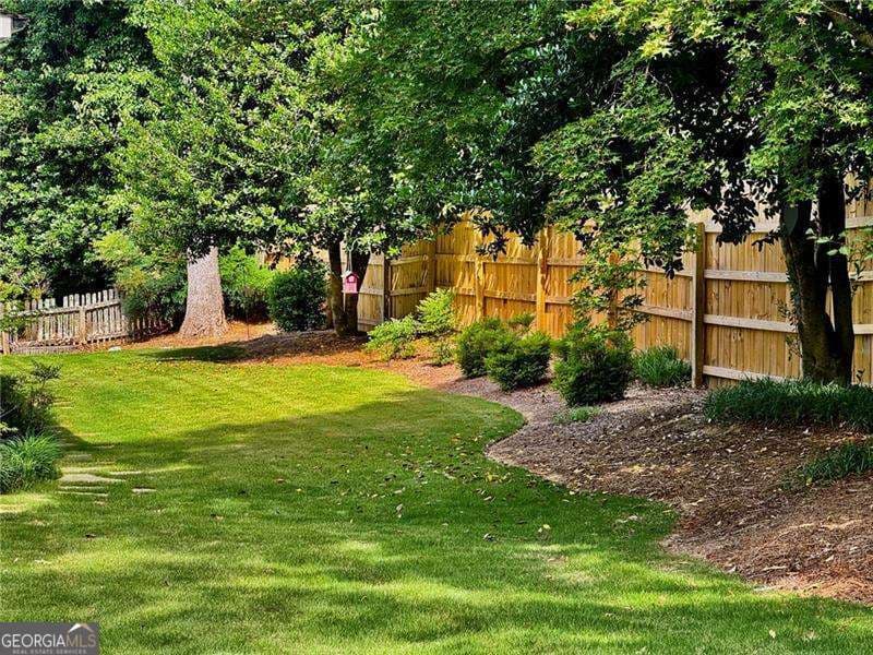 4 bedroom, 2.5 bathroom, 4,229 sq ft single family residence for sale at 3013 Braxton Court, Kennesaw, GA 30152 — photo 4