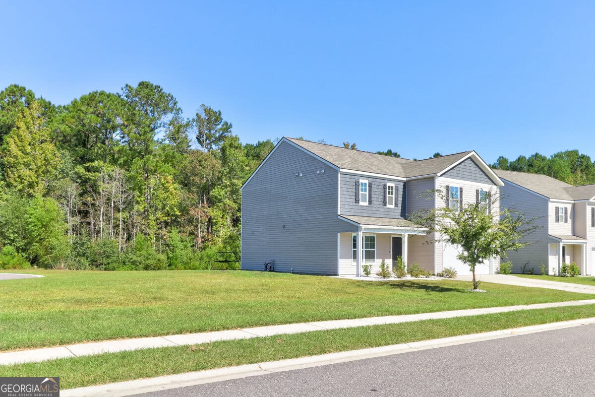 5 bedroom, 2.5 bathroom, 2,340 sq ft single family residence for sale at 118 Aruba Road, Guyton, GA 31312 — photo 2