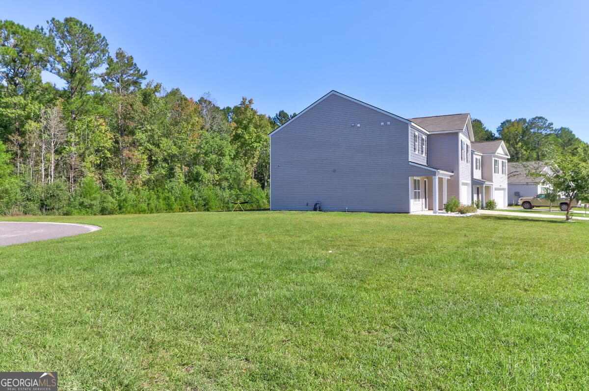 5 bedroom, 2.5 bathroom, 2,340 sq ft single family residence for sale at 118 Aruba Road, Guyton, GA 31312 — photo 3