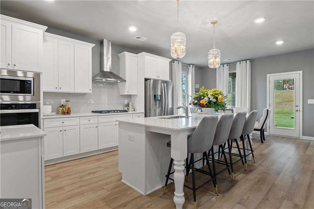 5 bedroom, 4.5 bathroom, 3,699 sq ft single family residence for sale at 121 Dohrn Drive, Loganville, GA 30052 — photo 4