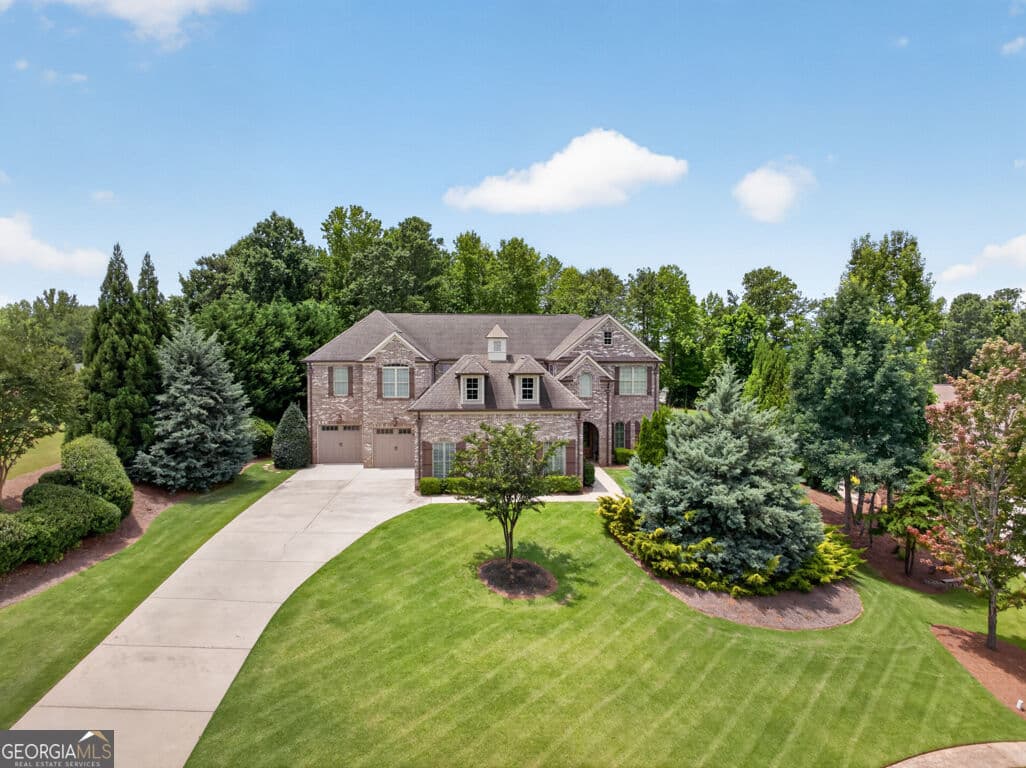 6 bedroom, 6.5 bathroom, 6,101 sq ft single family residence for sale at 6509 Snug Harbor Court, Flowery Branch, GA 30542 — photo 1 of 54