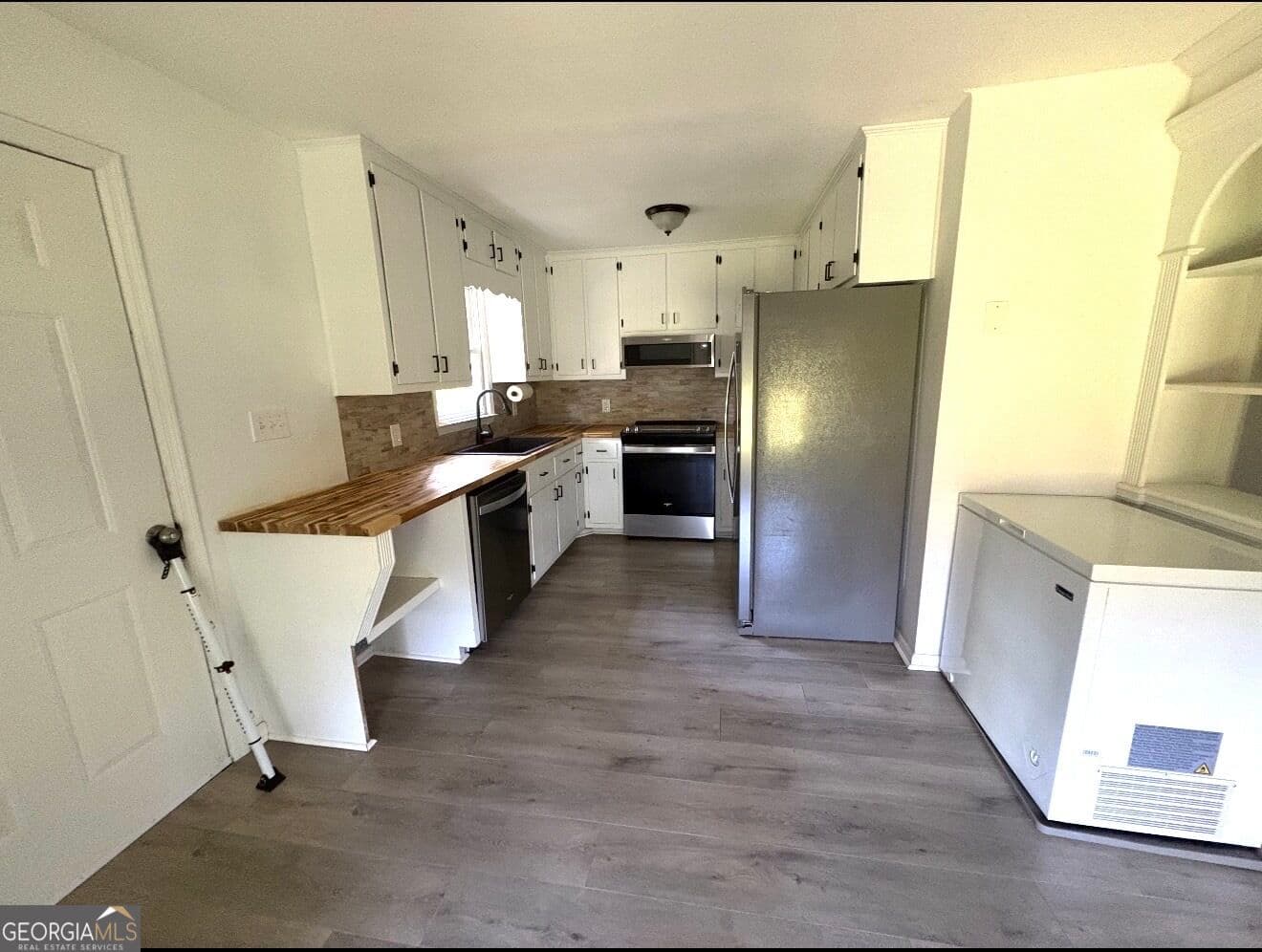 3 bedroom, 2 bathroom, 1,558 sq ft single family residence for sale at 1468 Highway 41, Milner, GA 30257 — photo 3