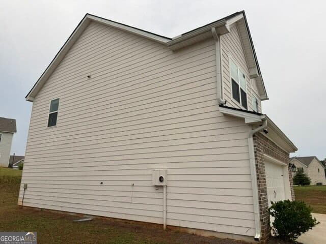 4 bedroom, 2.5 bathroom, 2,191 sq ft single family residence for sale at 1156 Bodega Loop, Locust Grove, GA 30248 — photo 2