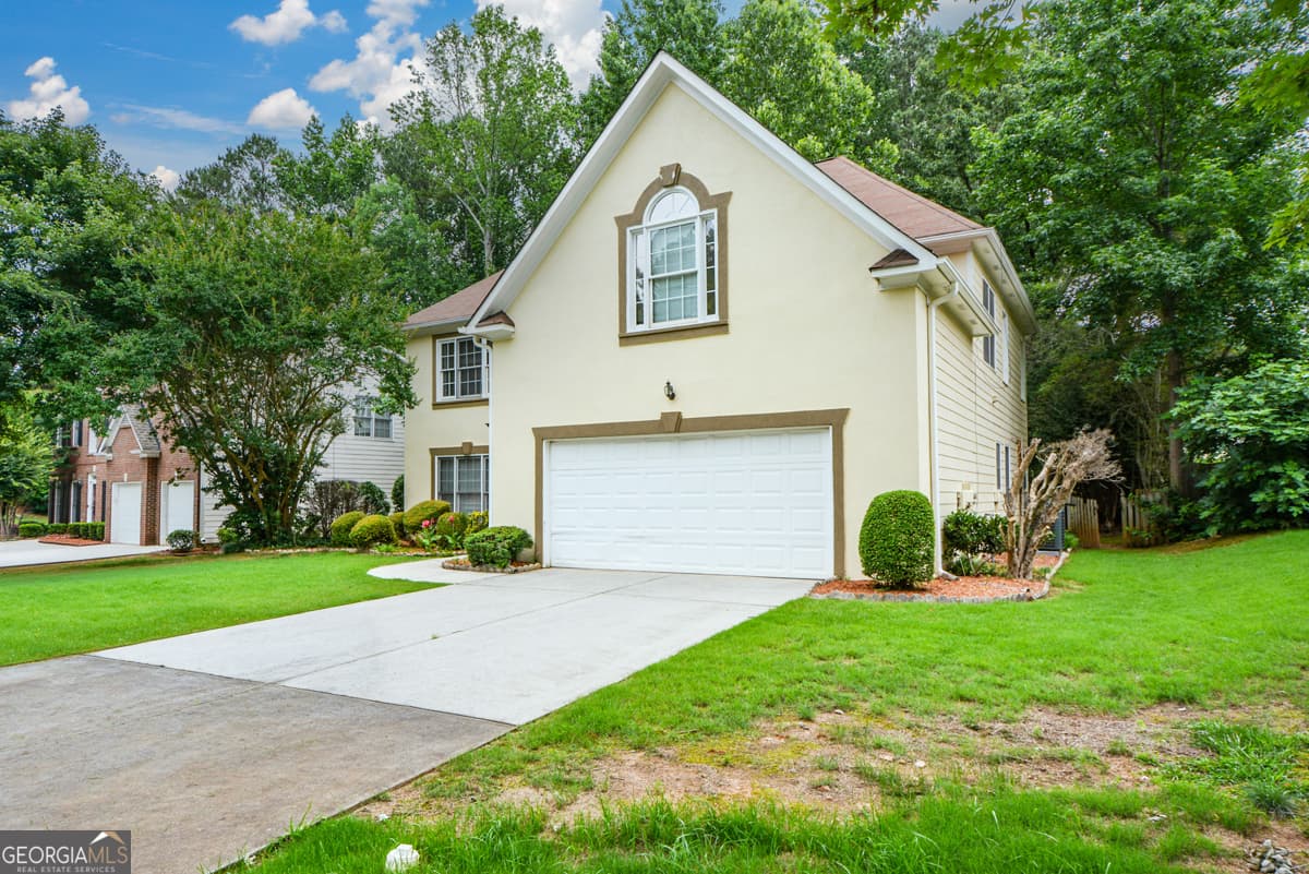 4 bedroom, 2.5 bathroom, 2,118 sq ft single family residence for sale at 4736 Cedar Wood Drive, Lilburn, GA 30047 — photo 2