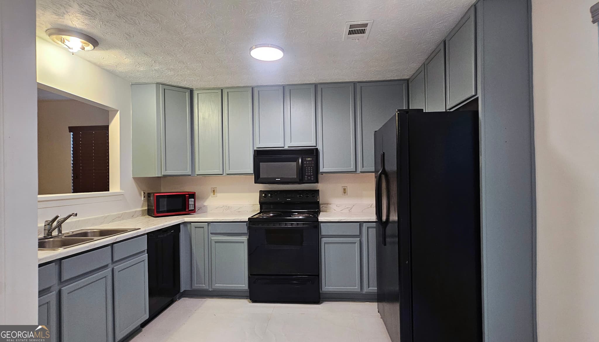 3 bedroom, 2.5 bathroom single family residence for sale at 5851 Giles Road, Lithonia, GA 30058 — photo 4