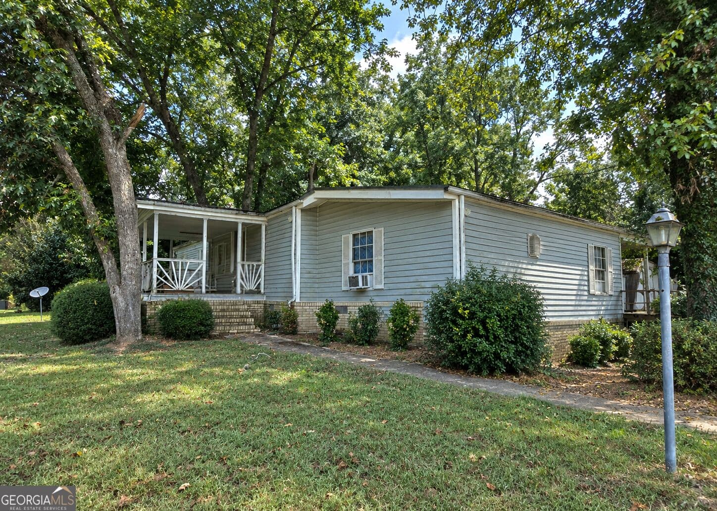 3 bedroom, 2 bathroom, 1,558 sq ft manufactured home,single family residence for sale at 810 Steele Drive, Hampton, GA 30228 — photo 2