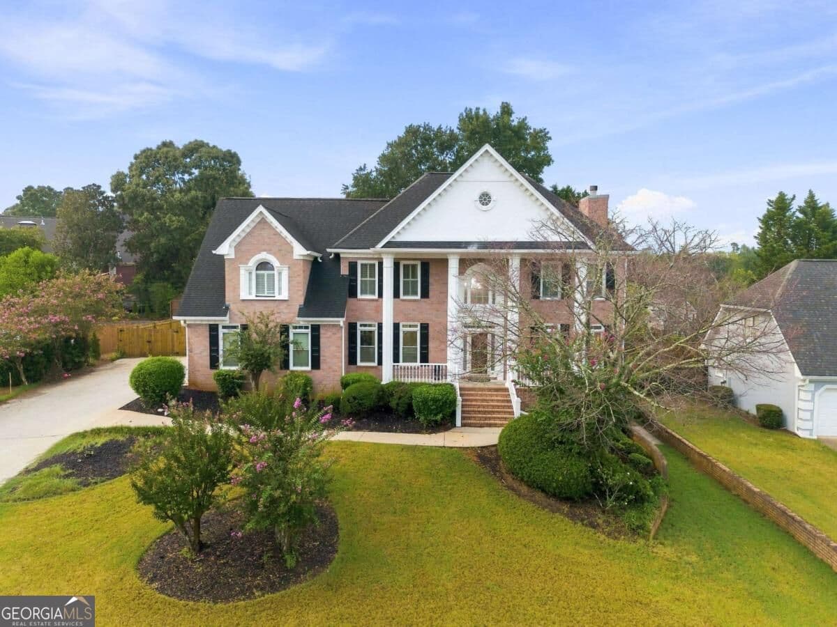 5 bedroom, 4.5 bathroom, 4,097 sq ft single family residence for sale at 4339 Donerail Drive, Snellville, GA 30039 — photo 1 of 69