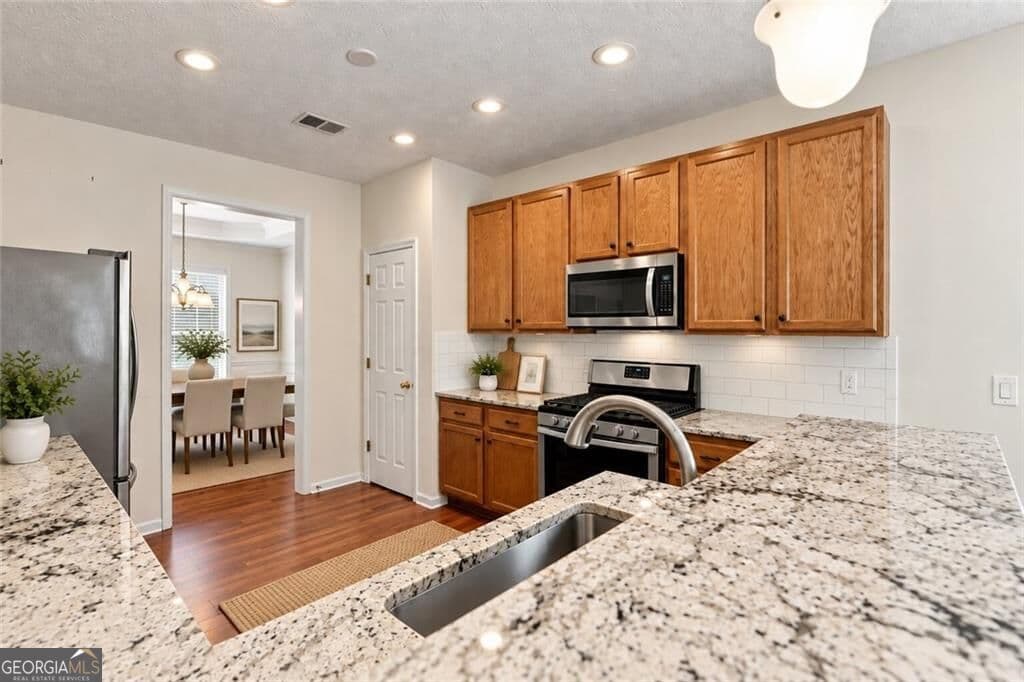 4 bedroom, 2.5 bathroom, 2,452 sq ft single family residence for sale at 926 Mill Creek Avenue, Canton, GA 30115 — photo 6