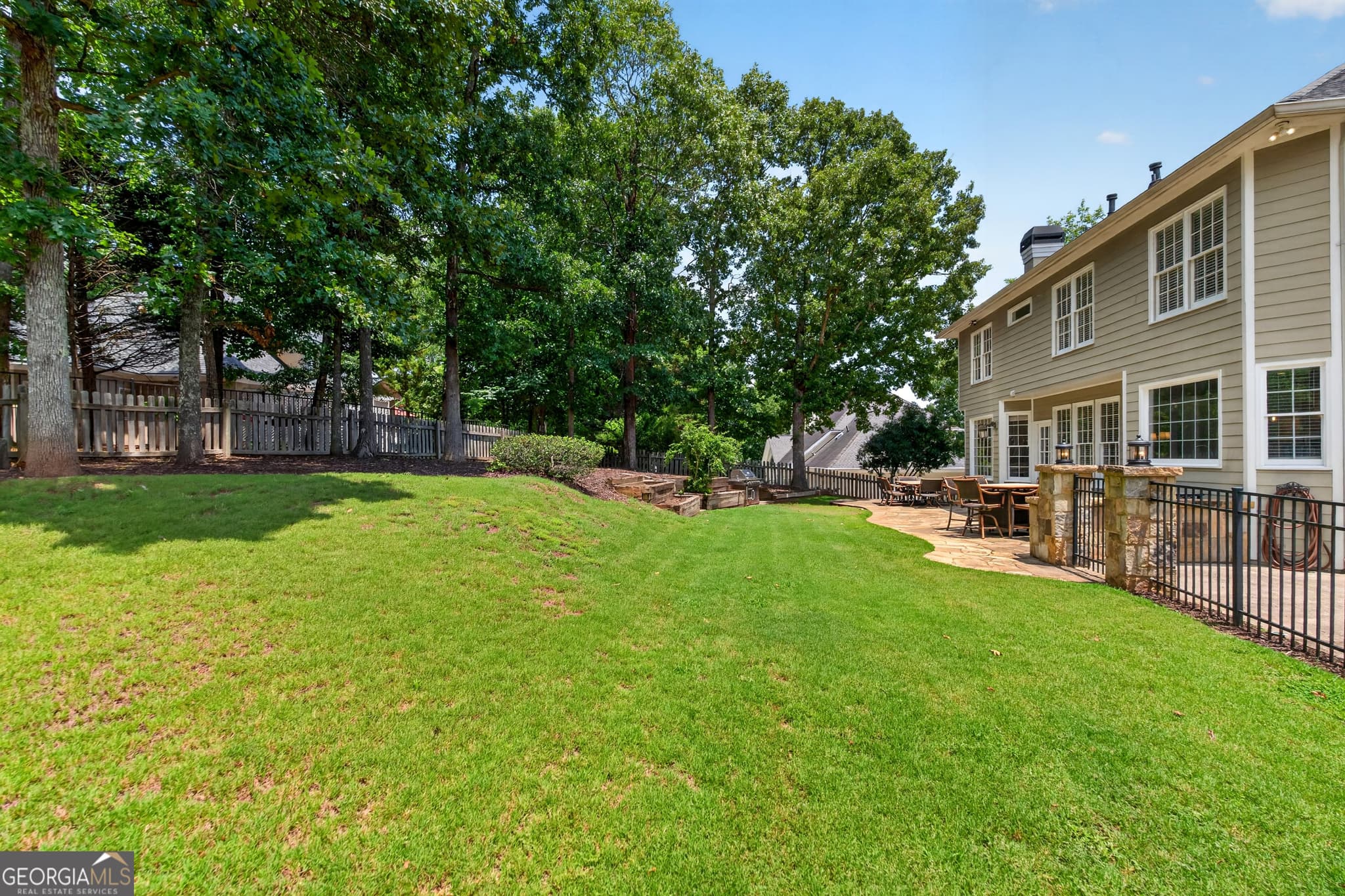 6 bedroom, 4.5 bathroom, 4,800 sq ft single family residence for sale at 5490 Hampstead Way, Johns Creek, GA 30097 — photo 4