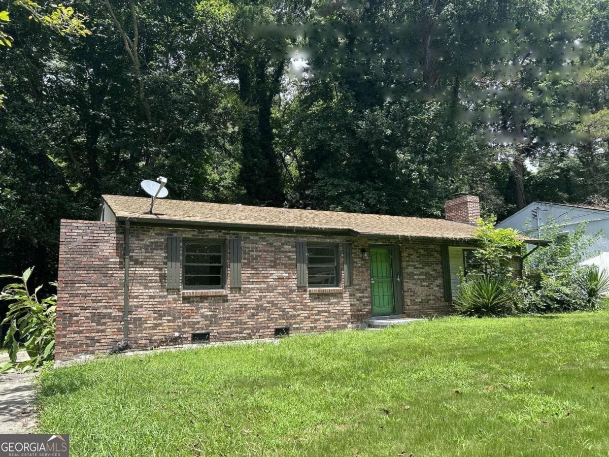 3 bedroom, 2 bathroom, 1,100 sq ft single family residence for sale at 2740 Santa Barbara Drive, Atlanta, GA 30318 — photo 1 of 6