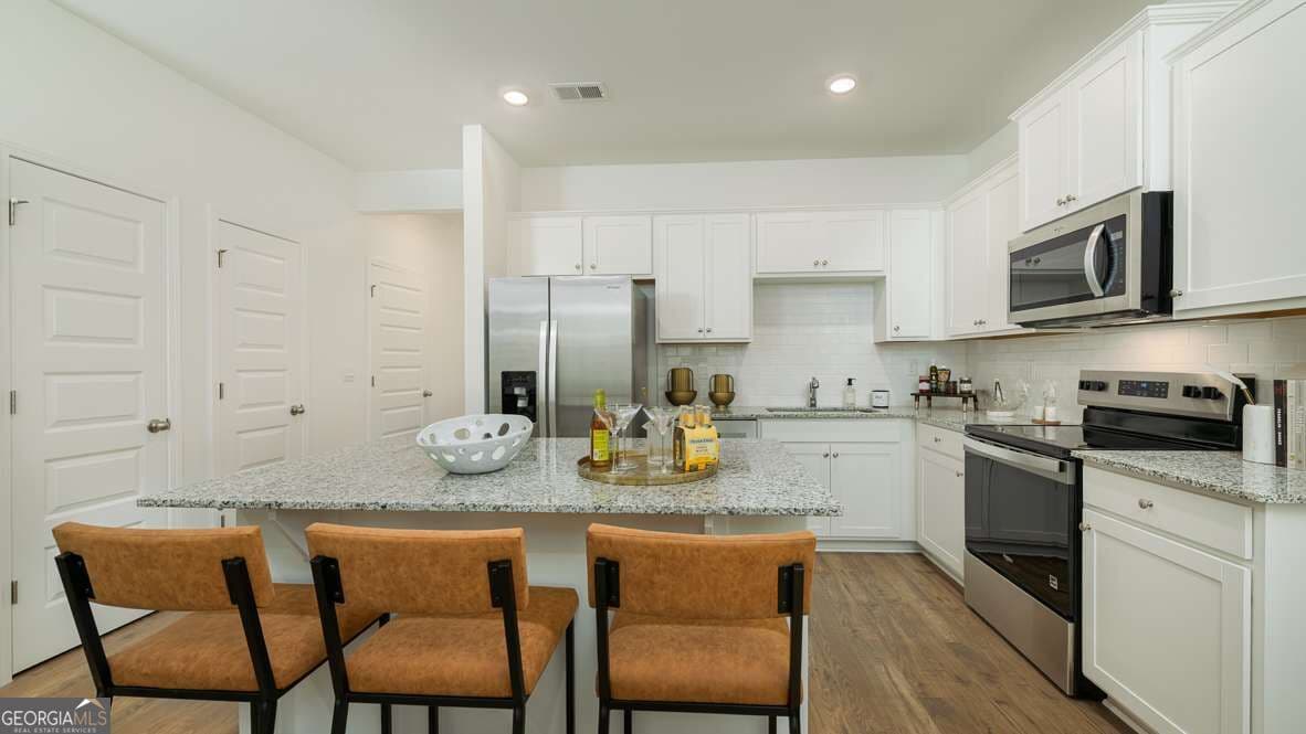 3 bedroom, 2.5 bathroom townhouse for sale at 1397 Sweetshrub Place 24, Atlanta, GA 30349 — photo 4