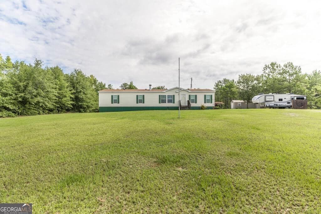 4 bedroom, 2 bathroom, 1,904 sq ft manufactured home,single family residence for sale at 1222 Bowers Cemetery Road, Cochran, GA 31014 — photo 2
