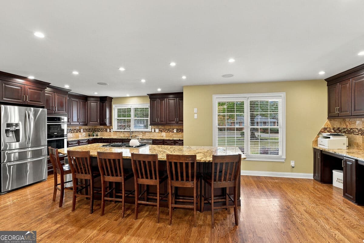 5 bedroom, 4.5 bathroom, 4,849 sq ft single family residence for sale at 2460 Due West Circle, Kennesaw, GA 30152 — photo 4