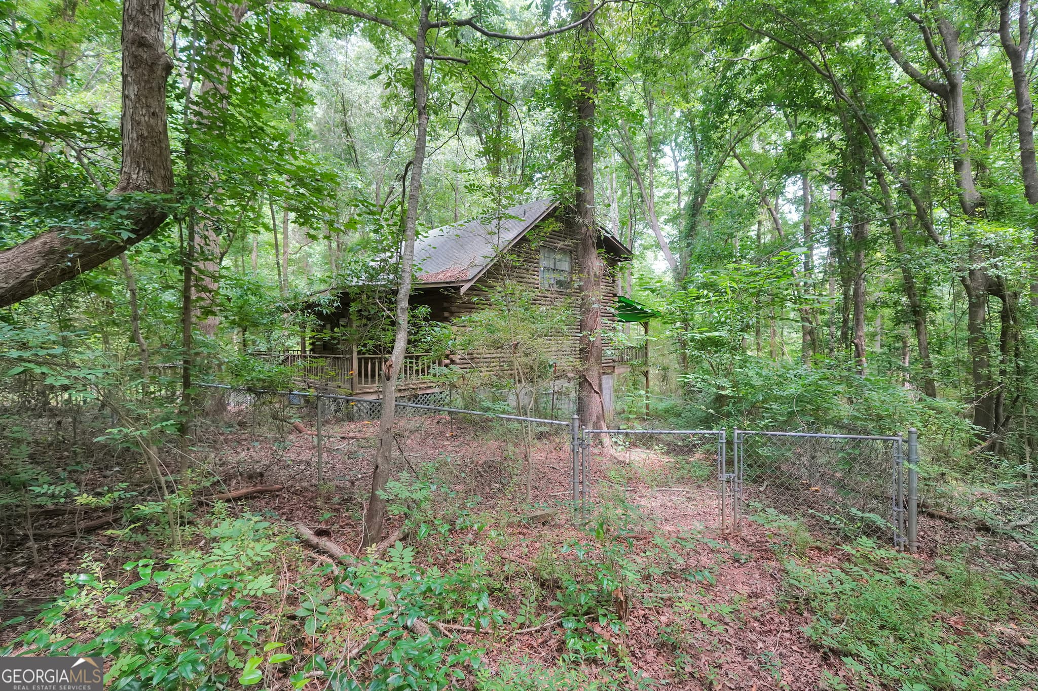 1 bedroom, 2 bathroom, 1,604 sq ft cabin,single family residence for sale at 235 Leguin Mill Road, Locust Grove, GA 30248 — photo 2