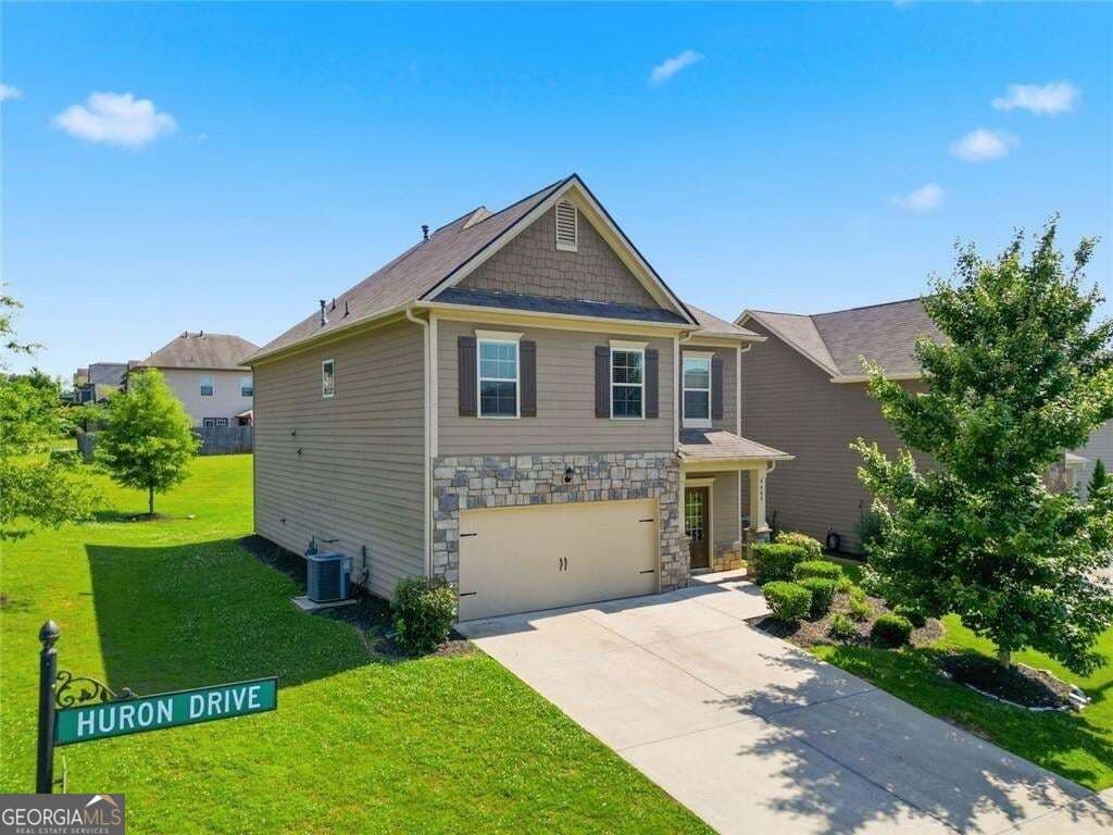 5 bedroom, 3 bathroom, 2,442 sq ft single family residence for sale at 4480 Huron Drive, Cumming, GA 30028 — photo 2