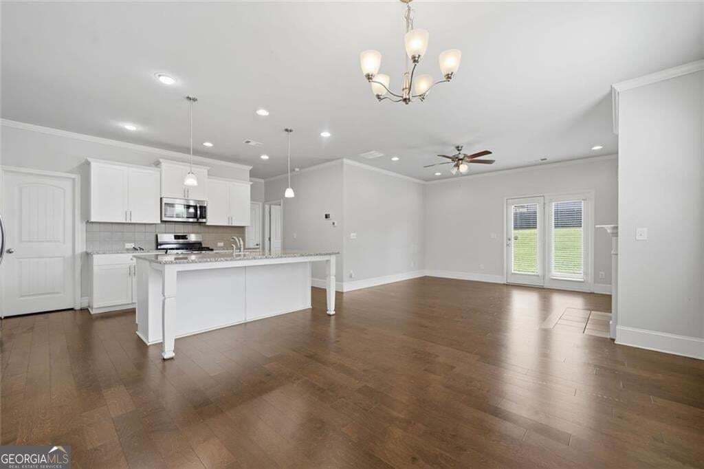 5 bedroom, 3 bathroom, 2,442 sq ft single family residence for sale at 4480 Huron Drive, Cumming, GA 30028 — photo 5