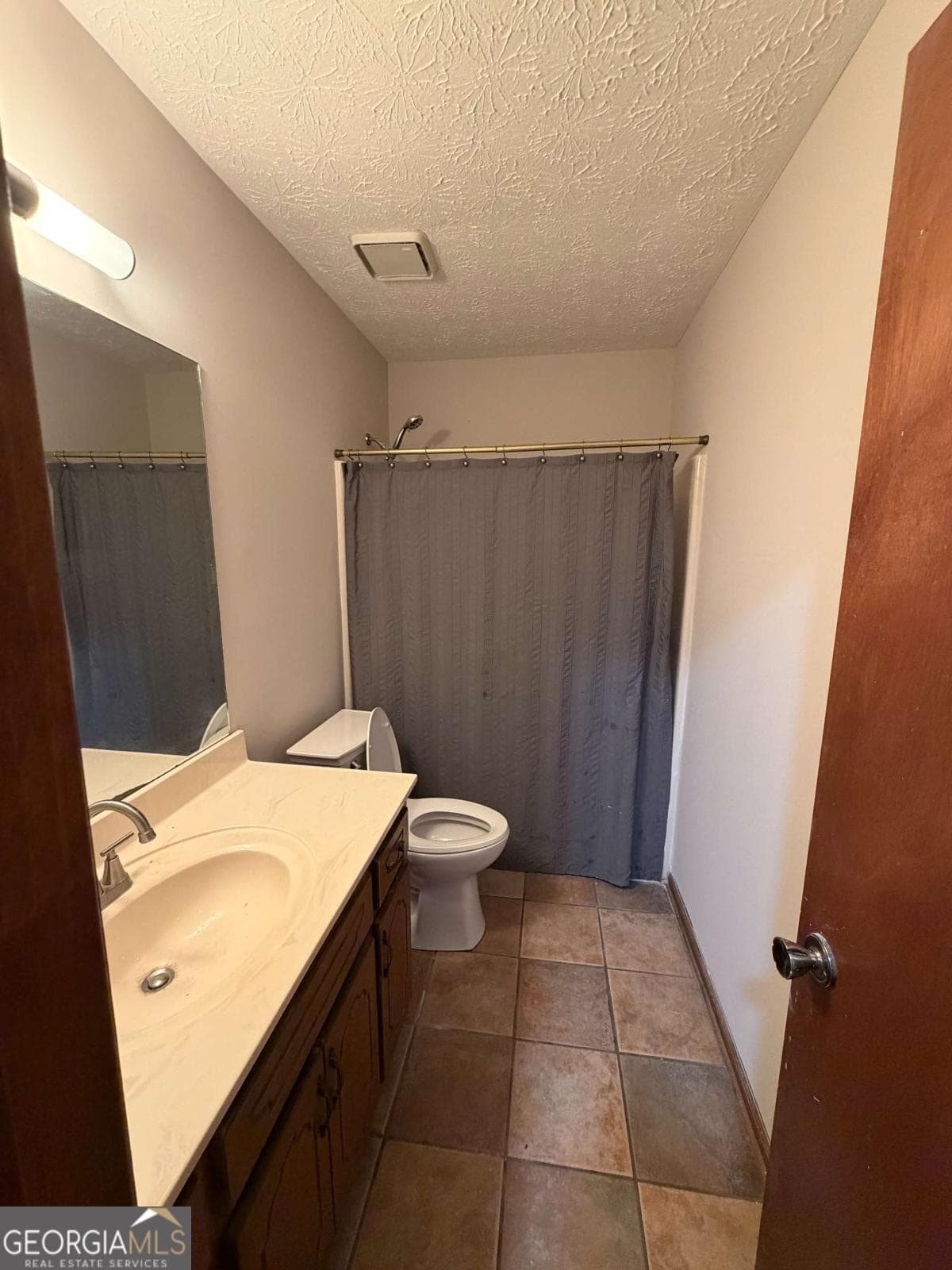 3 bedroom, 2 bathroom, 1,176 sq ft single family residence for sale at 1094 Crystal Lake Road, Atlanta, GA 30349 — photo 3