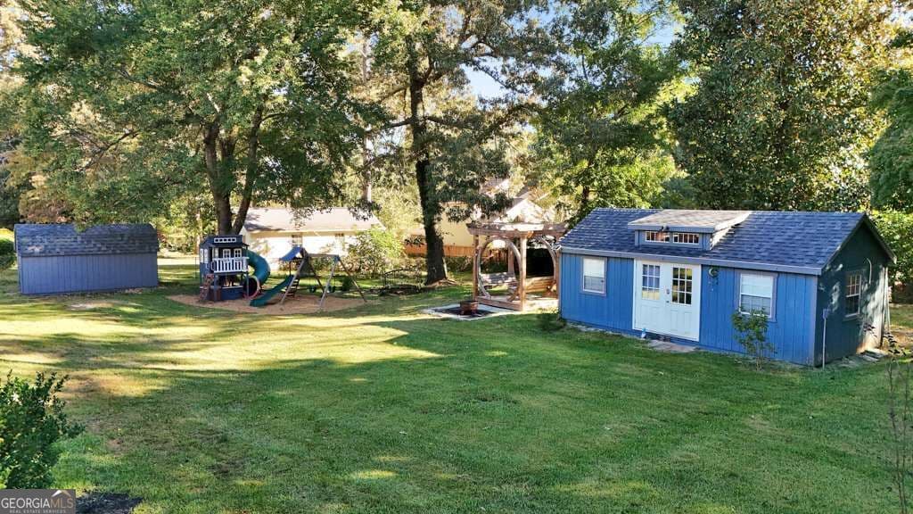 4 bedroom, 3 bathroom, 2,058 sq ft single family residence for sale at 1648 Lancaster Drive, Marietta, GA 30066 — photo 2
