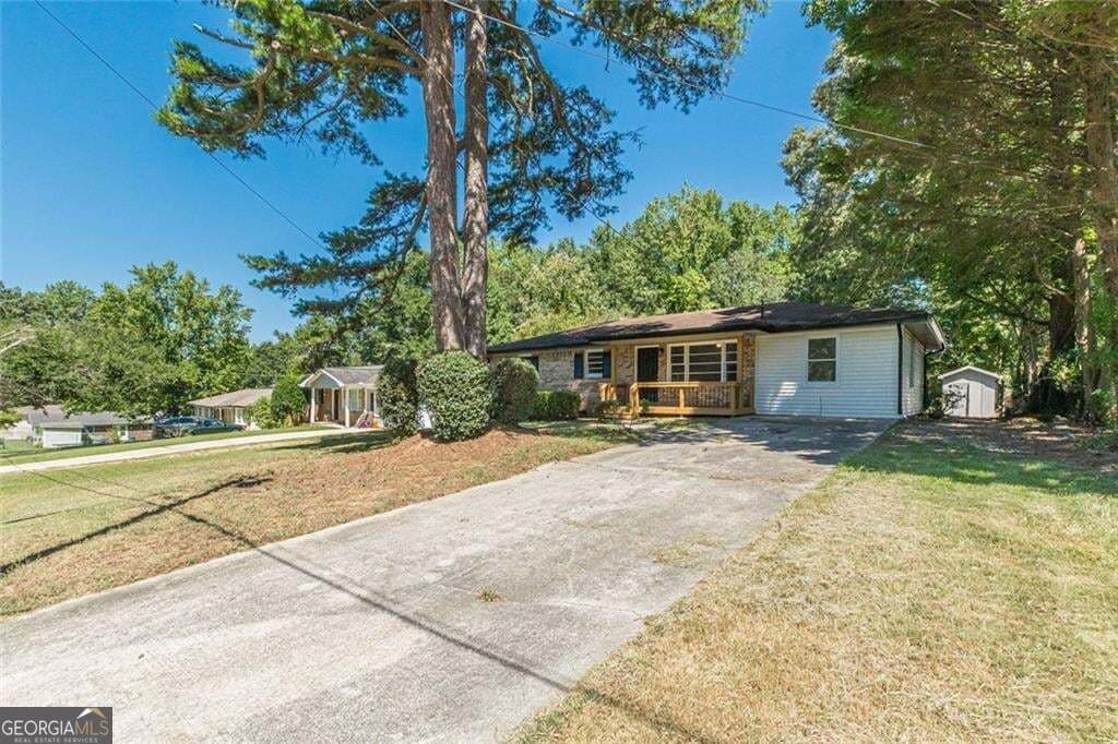4 bedroom, 2 bathroom, 1,352 sq ft single family residence for sale at 6405 Kensington Court, Austell, GA 30106 — photo 2