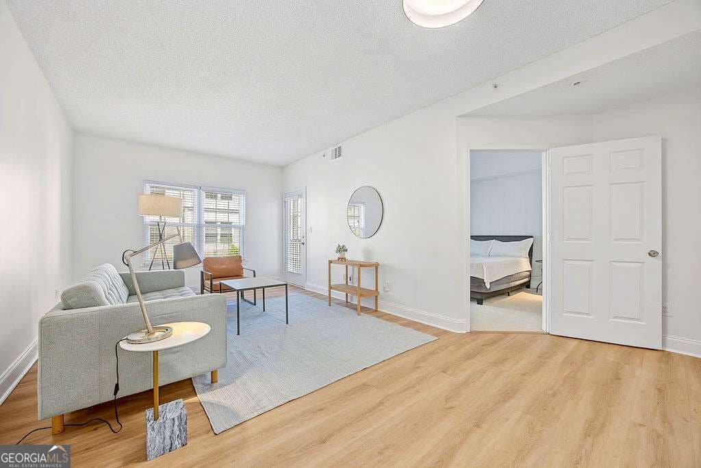 1 bedroom, 1 bathroom, 730 sq ft condominium for sale at 1075 Peachtree Walk A301, Atlanta, GA 30309 — photo 1 of 32