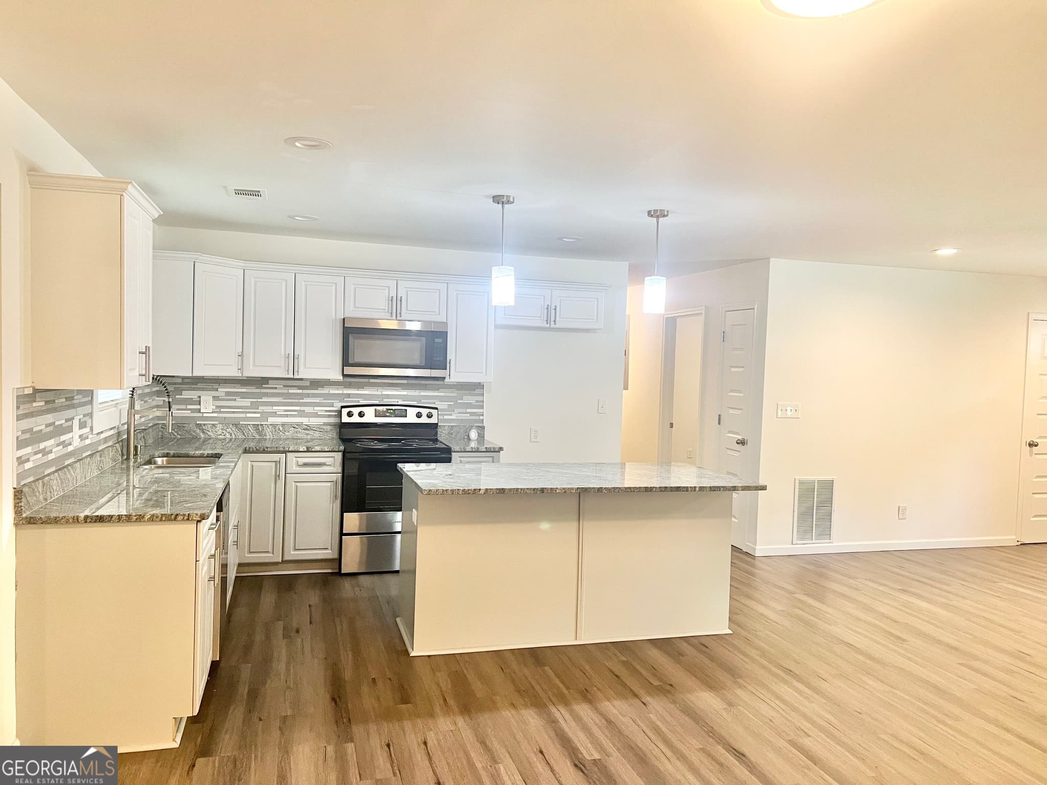 5 bedroom, 3 bathroom, 2,204 sq ft single family residence for sale at 5712 Attucks Boulevard, Morrow, GA 30260 — photo 4