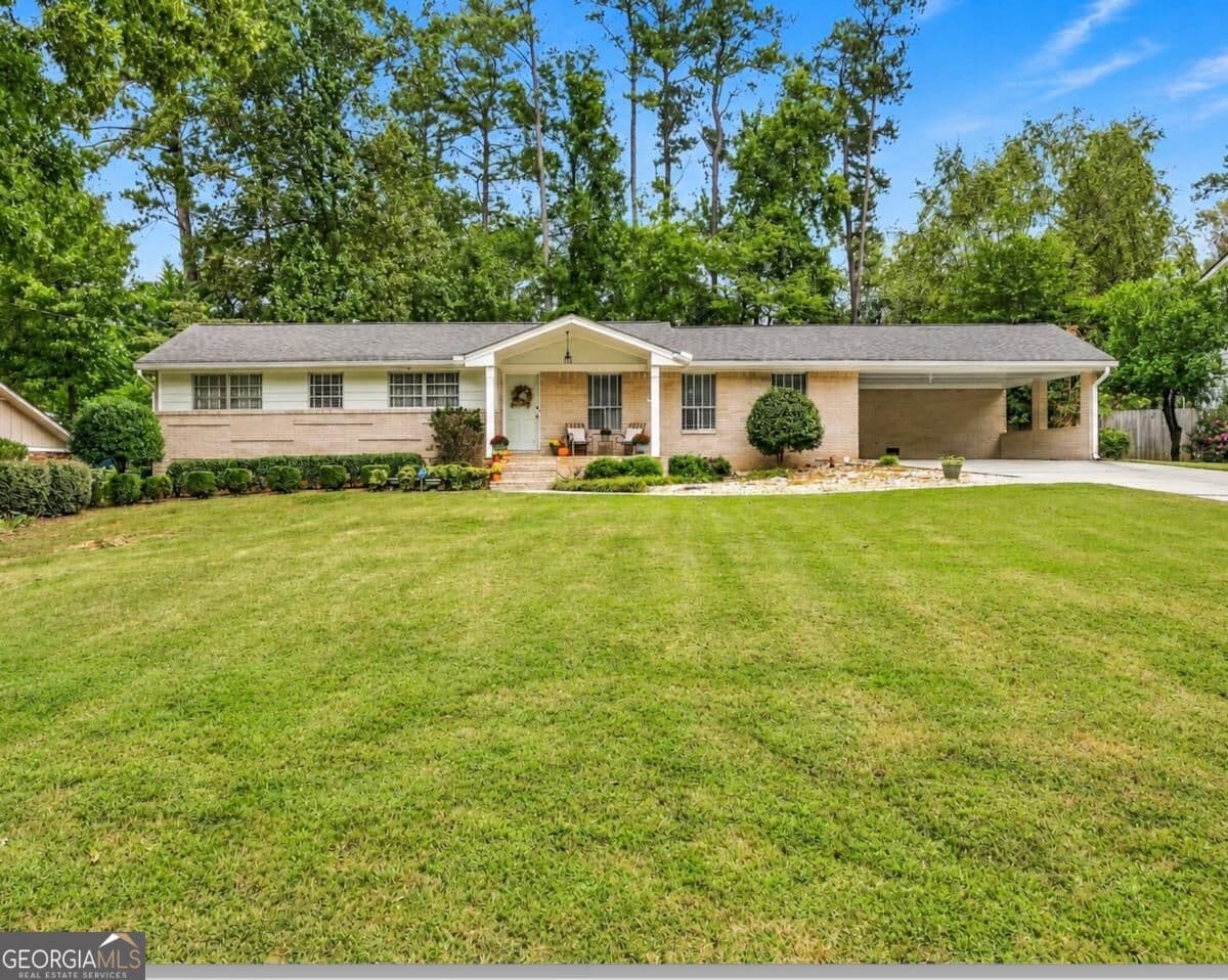 3 bedroom, 2 bathroom, 1,880 sq ft single family residence for sale at 2338 Kings Point Drive, Dunwoody, GA 30338