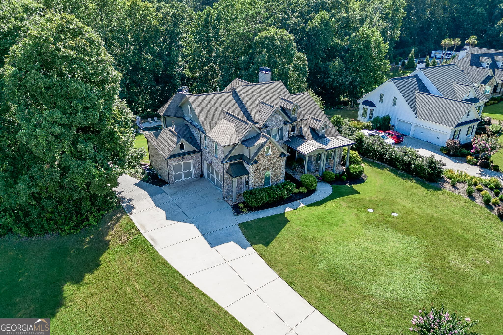 6 bedroom, 5.5 bathroom, 6,046 sq ft single family residence for sale at 1373 Mountain Lake Drive, Auburn, GA 30011 — photo 1 of 81