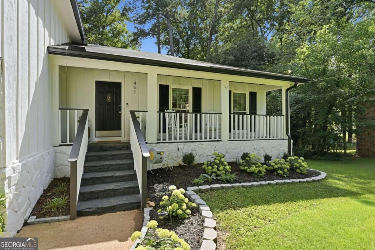 4 bedroom, 2.5 bathroom, 2,116 sq ft single family residence for sale at 451 Little John Drive, Lilburn, GA 30047 — photo 2