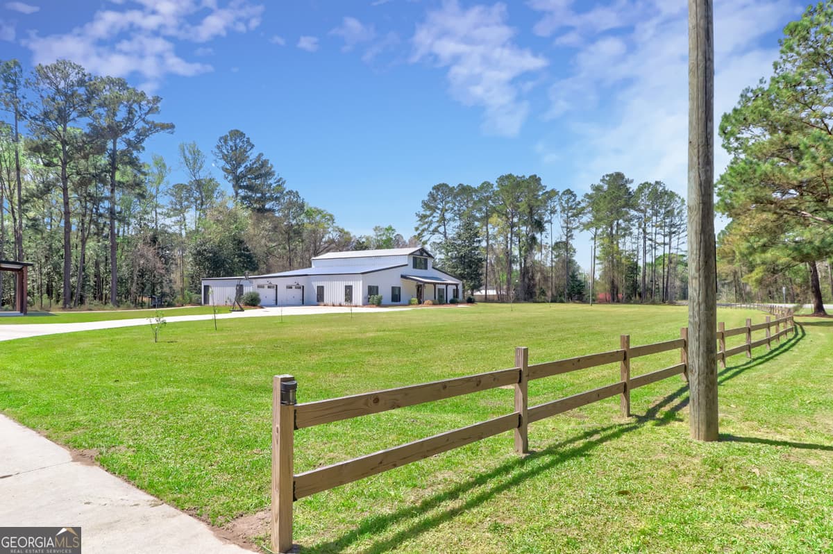 5 bedroom, 3.5 bathroom, 5,775 sq ft single family residence for sale at 3064 Little McCall Road, Rincon, GA 31326 — photo 5